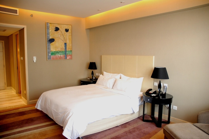 Imagen de la habitación del Hotel Wenjin. Foto 15