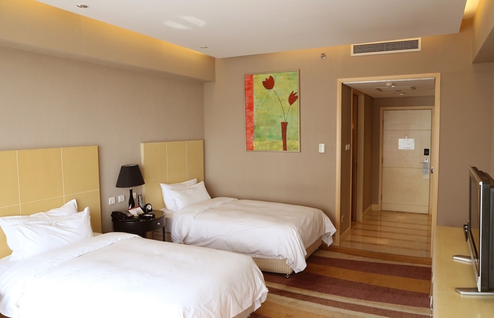 Imagen de la habitación del Hotel Wenjin. Foto 16