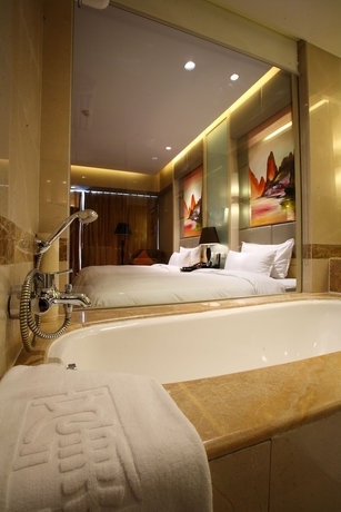 Imagen de la habitación del Hotel Wenjin. Foto 17