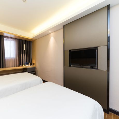 Imagen de la habitación del Hotel Wenxin Gangding. Foto 9