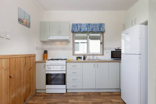 Imagen de la habitación del Hotel Werri Beach Holiday Park. Foto 6