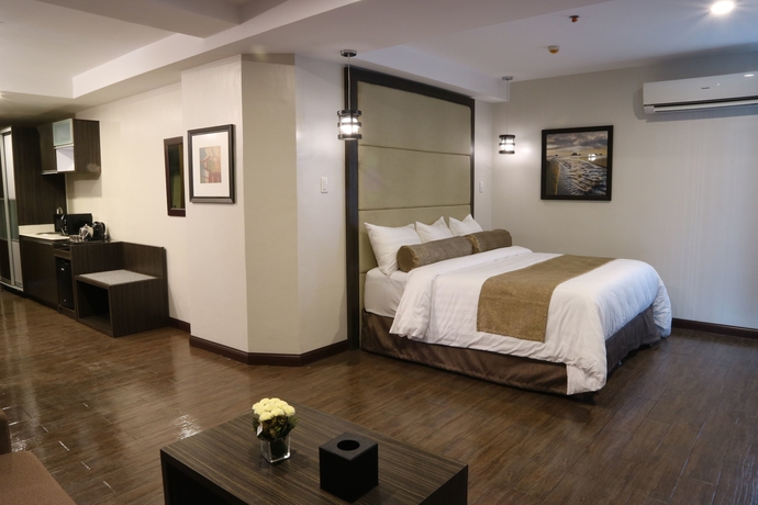 Imagen de la habitación del Hotel West Avenue Suites. Foto 12