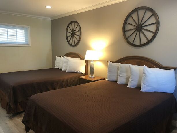 Imagen de la habitación del Hotel Westward Wagon Inn Theme Park Entrance. Foto 7