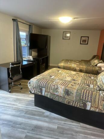 Imagen de la habitación del Hotel Whispering Pines Motel, Asheville. Foto 20