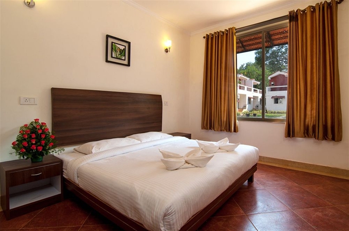 Imagen de la habitación del Hotel Whispering Woods. Foto 1