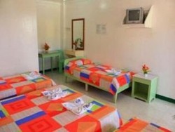 Imagen de la habitación del Hotel White Beach Bar and Restaurant. Foto 12