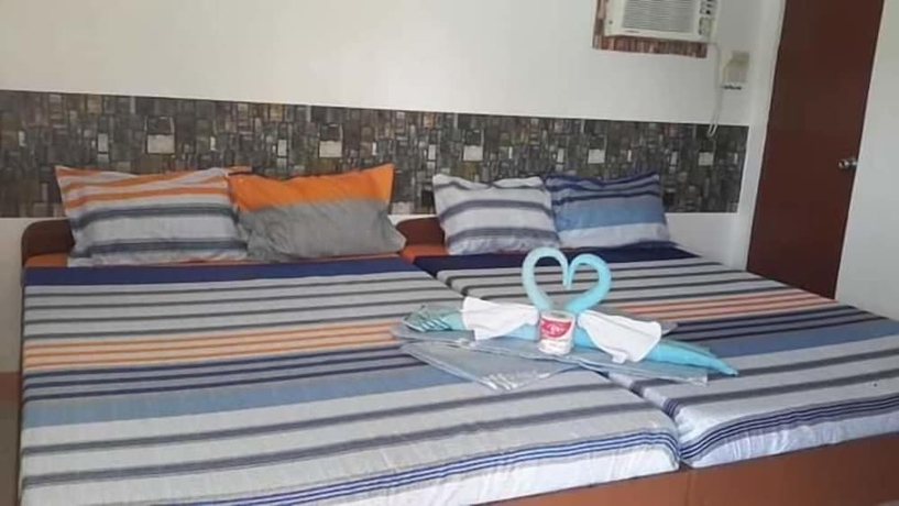 Imagen de la habitación del Hotel White Beach Guest House. Foto 10