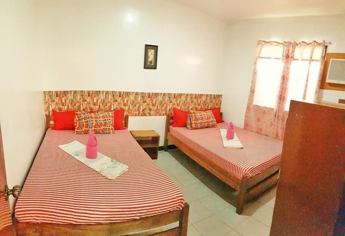 Imagen de la habitación del Hotel White Beach Guest House. Foto 11