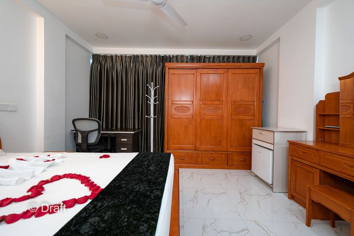 Imagen de la habitación del Hotel White Beach Holiday. Foto 17