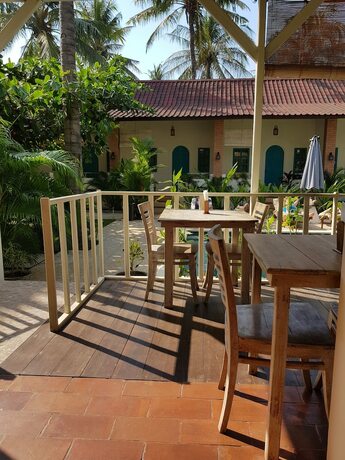 Imagen del bar/restaurante del Hotel White Coconut Cottage. Foto 18