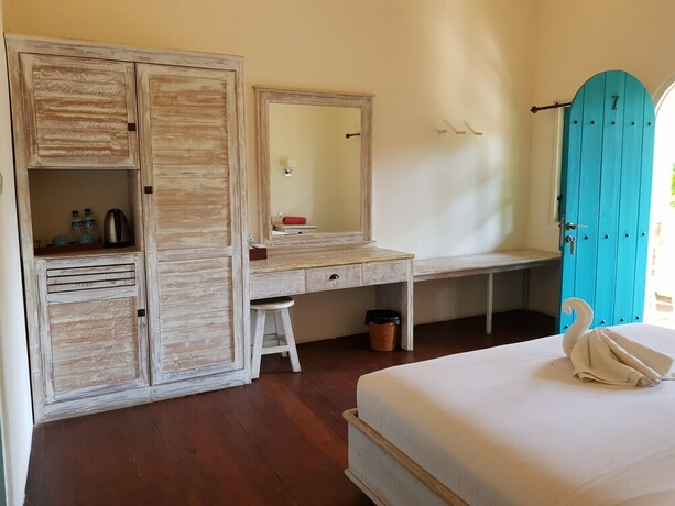 Imagen de la habitación del Hotel White Coconut Cottage. Foto 23