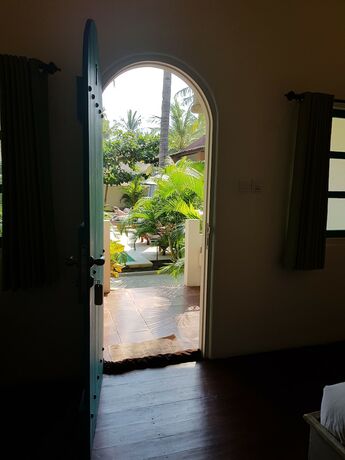 Imagen de la habitación del Hotel White Coconut Cottage. Foto 24