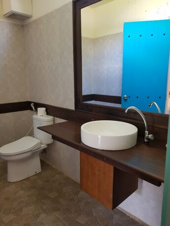 Imagen de la habitación del Hotel White Coconut Cottage. Foto 30