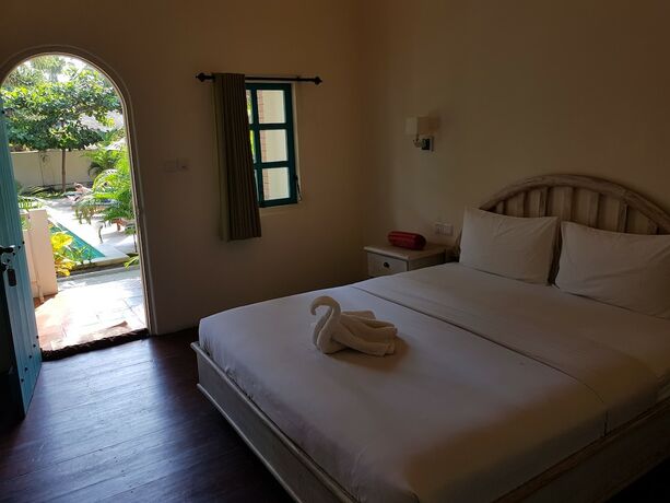 Imagen de la habitación del Hotel White Coconut Cottage. Foto 31