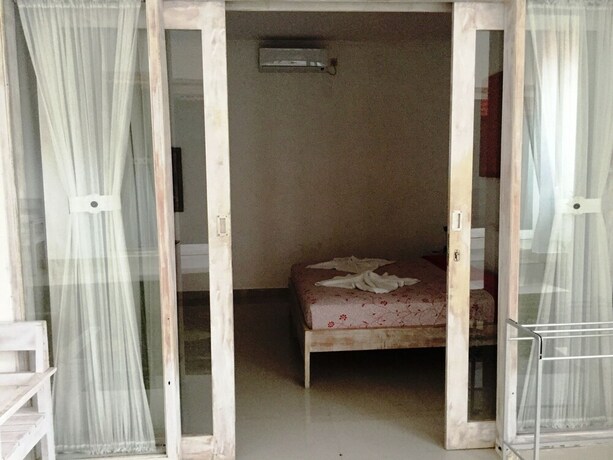 Imagen de la habitación del Hotel White Dove Villa. Foto 34