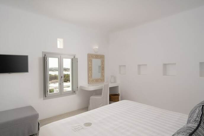 Imagen de la habitación del Hotel White Dunes Luxury Boutique. Foto 11