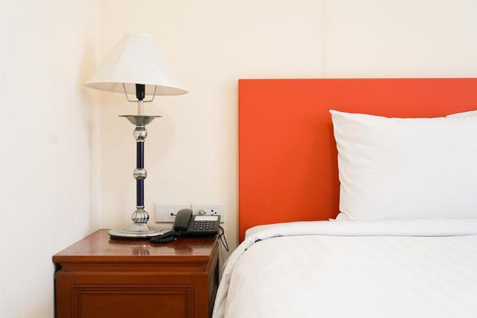 Imagen de la habitación del Hotel White House Bizotel. Foto 12