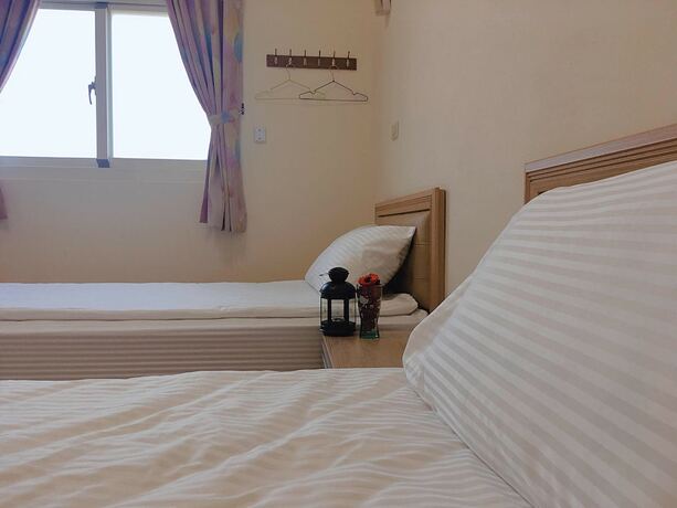 Imagen de la habitación del Hotel White House, Dongbao. Foto 15