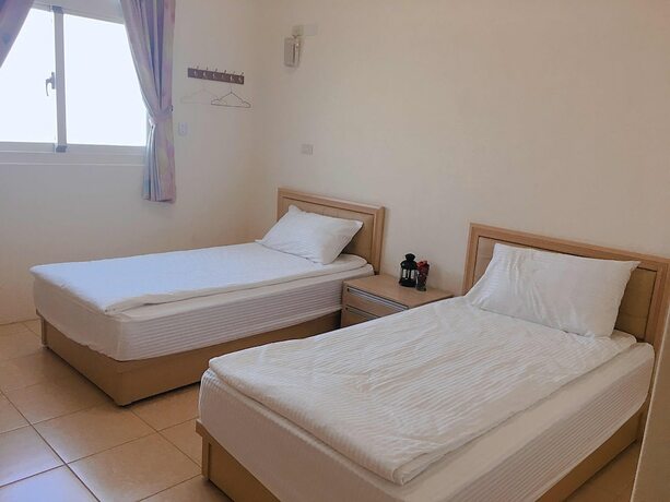 Imagen de la habitación del Hotel White House, Dongbao. Foto 18