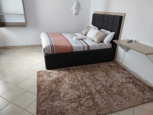 Imagen de la habitación del Hotel White House Lounge and Accommodation. Foto 13
