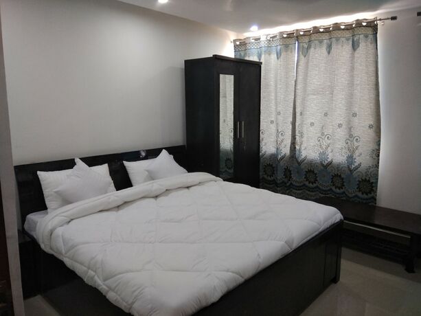 Imagen de la habitación del Hotel White House, Noida. Foto 13