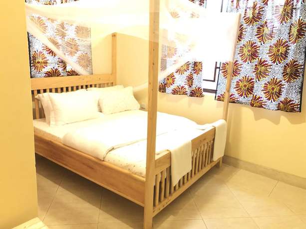Imagen de la habitación del Hotel White House of Tanzania - Hostel. Foto 19
