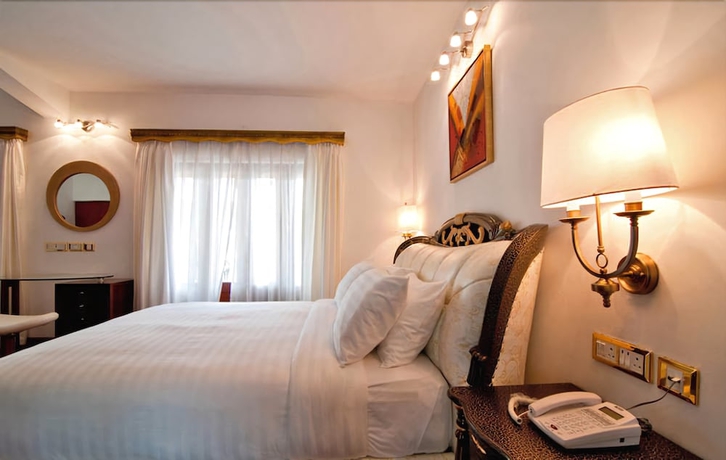 Imagen de la habitación del Hotel White Pearl Suites. Foto 7