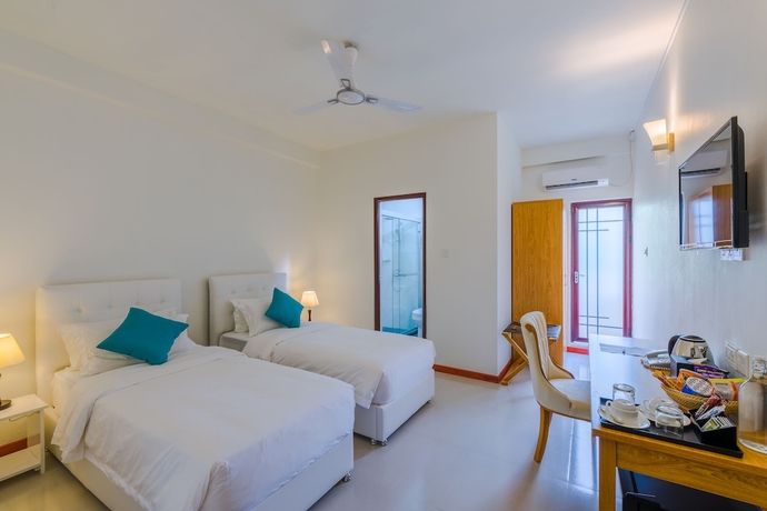 Imagen de la habitación del Hotel White Sand Dhigurah. Foto 6