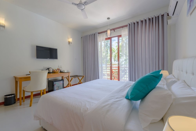 Imagen de la habitación del Hotel White Sand Dhigurah. Foto 9