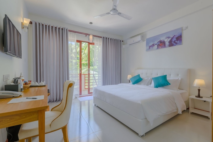Imagen de la habitación del Hotel White Sand Dhigurah. Foto 11