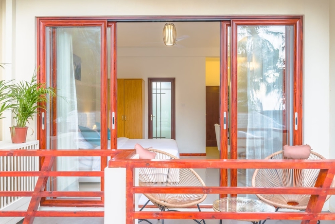 Imagen de la habitación del Hotel White Sand Dhigurah. Foto 12