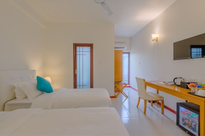 Imagen de la habitación del Hotel White Sand Dhigurah. Foto 14