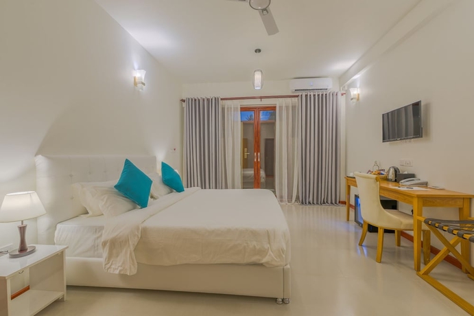 Imagen de la habitación del Hotel White Sand Dhigurah. Foto 17
