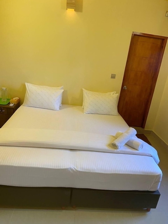 Imagen de la habitación del Hotel White Sand Inn. Foto 2