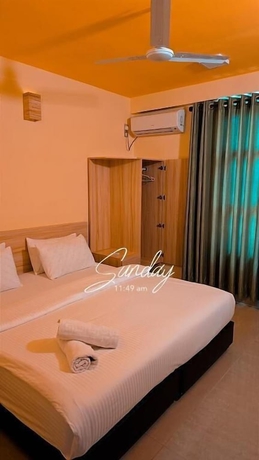 Imagen de la habitación del Hotel White Sand Inn. Foto 5