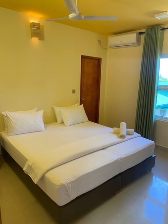 Imagen de la habitación del Hotel White Sand Inn. Foto 6