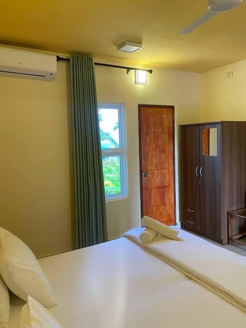 Imagen de la habitación del Hotel White Sand Inn. Foto 7