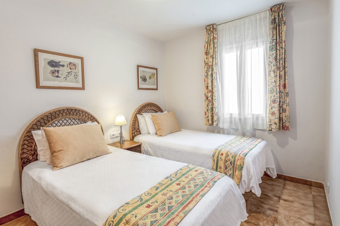 Imagen de la habitación del Hotel White Sands Beach Club. Foto 5