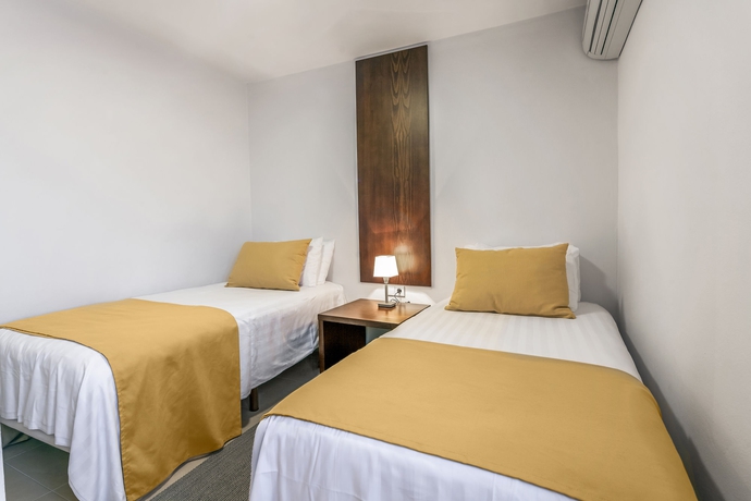 Imagen de la habitación del Hotel White Sands Beach Club. Foto 7