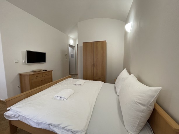 Imagen de la habitación del Hotel White Swan Boutique Apartments. Foto 6
