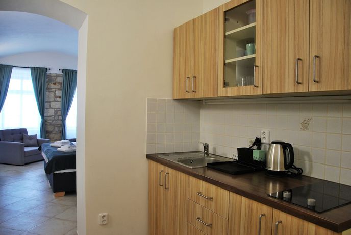 Imagen de la habitación del Hotel White Swan Boutique Apartments. Foto 20