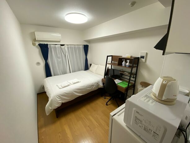 Imagen de la habitación del Hotel White Terrace Sakurashinmachi. Foto 16