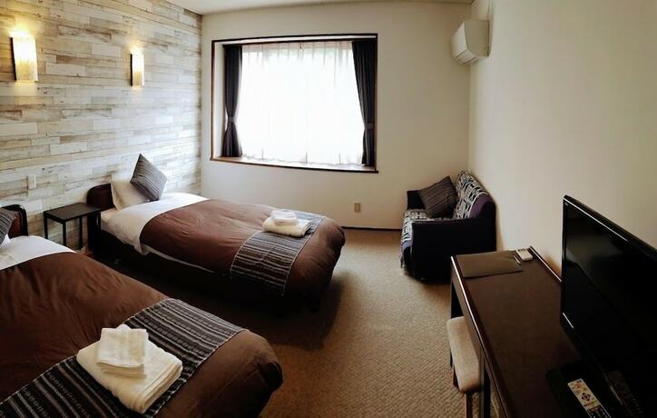 Imagen de la habitación del Hotel White Tree Lodge. Foto 12