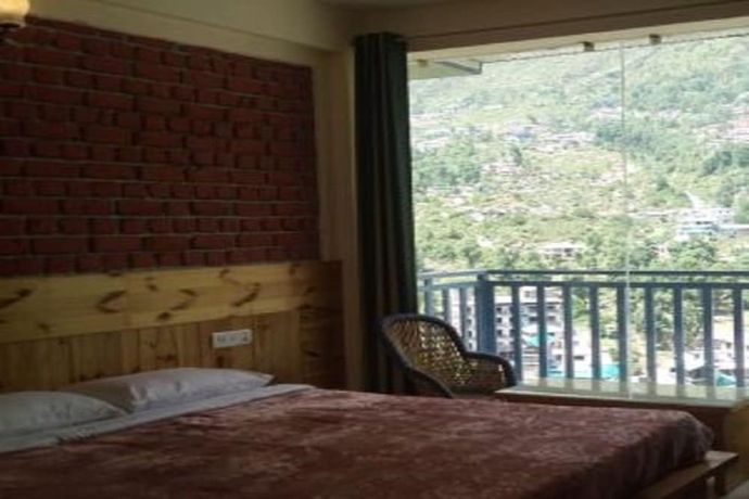 Imagen de la habitación del Hotel White Water Inn McLeodganj. Foto 8