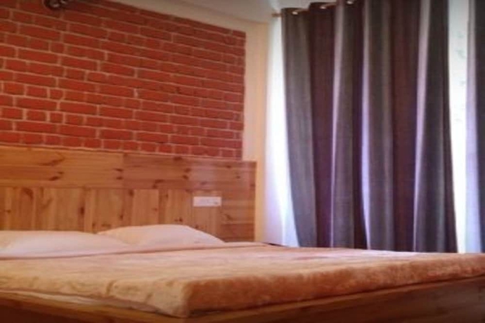 Imagen de la habitación del Hotel White Water Inn McLeodganj. Foto 10