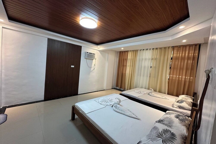 Imagen de la habitación del Hotel White-Beach Hideaway Resort Puerto Galera. Foto 2