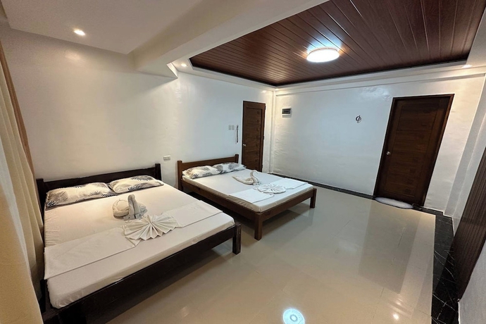Imagen de la habitación del Hotel White-Beach Hideaway Resort Puerto Galera. Foto 8