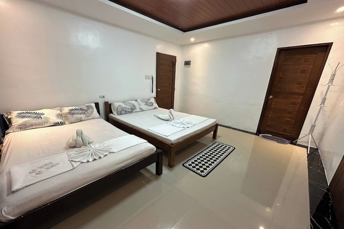 Imagen de la habitación del Hotel White-Beach Hideaway Resort Puerto Galera. Foto 10