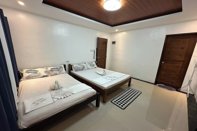 Imagen de la habitación del Hotel White-Beach Hideaway Resort Puerto Galera. Foto 11