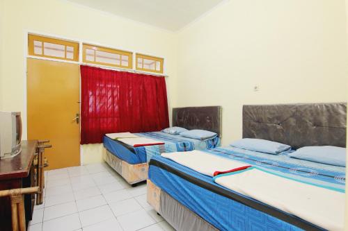 Imagen de la habitación del Hotel Wijaya 2 Kaliurang. Foto 12